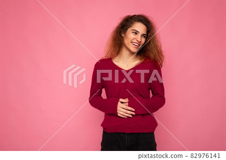 Photo of young happy positive pretty nice brunette wavy woman with sincere emotions wearing casual Photo of young happy positive pretty nice brunette wavy woman with sincere emotions wearing casual 82976141