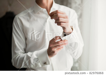 Beautiful man, groom posing and preparing for wedding 82976868