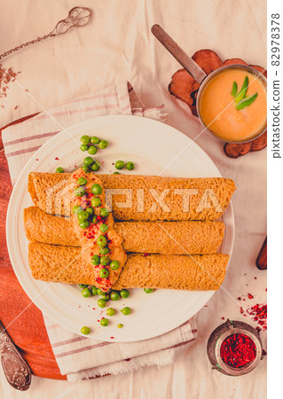 Homemade Coconut flour and turmeric keto wraps with cottage cheese sauce. Low-carb gluten free crepe with curry sauce and sweet corn and green peas on top Homemade Coconut flour and turmeric keto wraps with cottage cheese sauce. Low-carb gluten free crepe with curry sauce and sweet corn and green peas on top 82978378