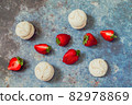 strawberries and marshmallows on a blue metal background. Healthy lifestyle and summer diet detox food concept. Copy space for text 82978869
