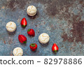 White marshmallows and strawberries with coffee on a blue metal background. Free space for text.Top view.Holiday and festive food concept 82978886