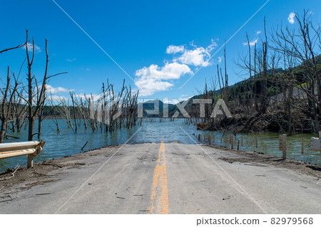 Yubari City, Hokkaido Old Road sinking in Shuparo Lake Yubari City, Hokkaido Old Road sinking in Shuparo Lake 82979568