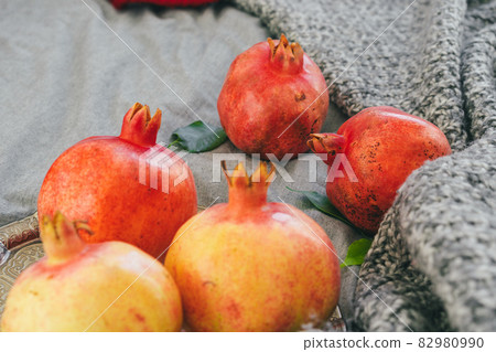 Pomegranate on a gray plaid close up 82980990