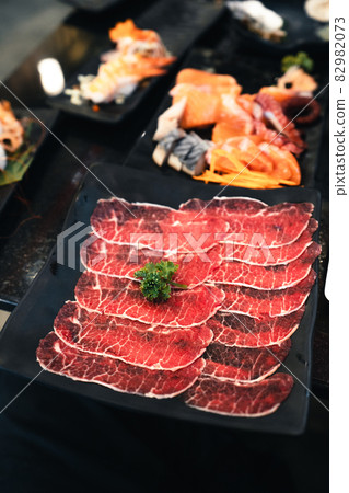 Sliced beef shabu in a black plate in a restaurant 82982073