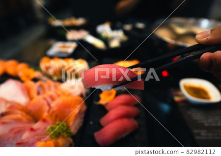 Sashimi and sashimion a plate in a Japanese restaurant Sashimi and sashimion a plate in a Japanese restaurant 82982112