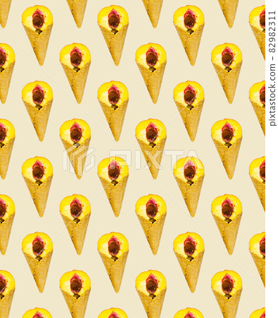 Pattern of Half a ripe peach in sweet wafer cone in Orange background, Creative Food Concept, Flatlay 82982311