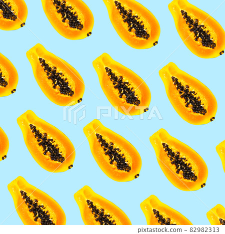 Papaya Fruit seamless pattern on blue background, flat lay, top view, Exotic Fruit Pattern, Food concept Papaya Fruit seamless pattern on blue background, flat lay, top view, Exotic Fruit Pattern, Food concept 82982313