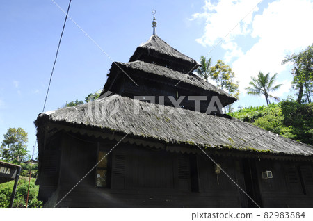WEST SUMATERA, INDONESIA -JUNE 8, 2014: Tuo Kayu Jao Mosque is located in West Sumatra, Indonesia. Built in 1599 and is the second oldest mosque in Indonesia. WEST SUMATERA, INDONESIA -JUNE 8, 2014: Tuo Kayu Jao Mosque is located in West Sumatra, Indonesia. Built in 1599 and is the second oldest mosque in Indonesia. 82983884