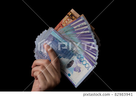 Tenge on black background. Kazakh money. Banknotes tenge. Money Kazakhstan Tenge Tenge on black background. Kazakh money. Banknotes tenge. Money Kazakhstan Tenge 82983941