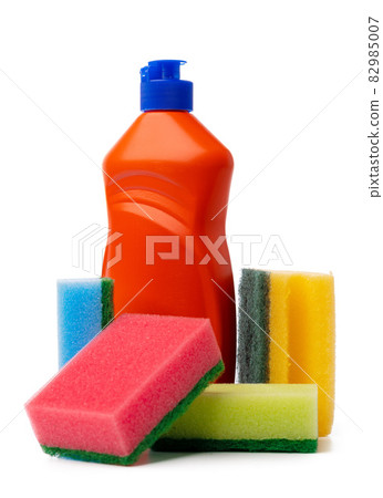 Bottles with cleaning products and sponge on a white isolated background 82985007