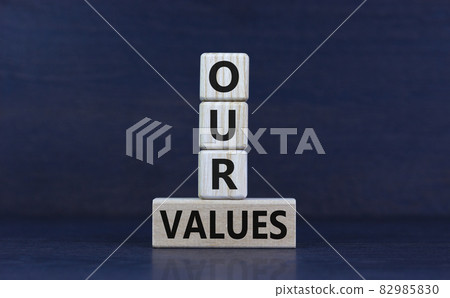 Our values symbol. Wooden cubes and block with words 'our values' on beautiful grey background. Business and our values concept, copy space. 82985830