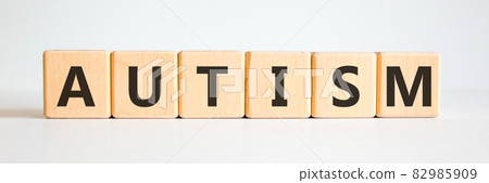 Autism symbol. Wooden cubes with the word 'autism'. Beautiful white background. Psychological, medical, business and autism concept. Copy space. Autism symbol. Wooden cubes with the word 'autism'. Beautiful white background. Psychological, medical, business and autism concept. Copy space. 82985909
