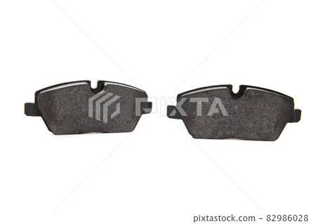 two brake pads on an isolated white background two brake pads on an isolated white background 82986028