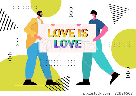 gays holding placard with rainbow love is love text LGBT parade pride festival transgender love concept 82986508