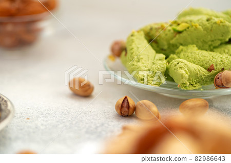 Close up of colorful Turkish halva sweets on gray surface Close up of colorful Turkish halva sweets on gray surface 82986643