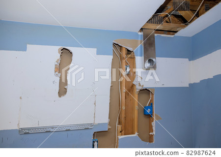 Construction home the install of HVAC vent duct pipes in ceiling 82987624