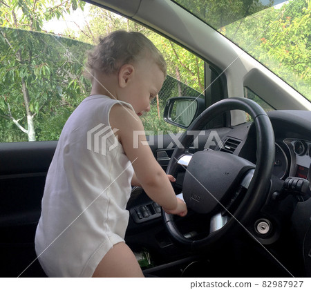 Beautiful baby boy with child face posing photographer 82987927