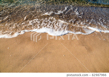 Soft wave of the sea on the sandy beach 82987966