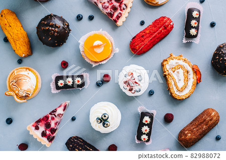 Assortment of confectionery, different types of cakes and desserts on the table. Assortment of confectionery, different types of cakes and desserts on the table. 82988072