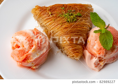 Close up photo of Turkish baklava served with ice cream Close up photo of Turkish baklava served with ice cream 82989227