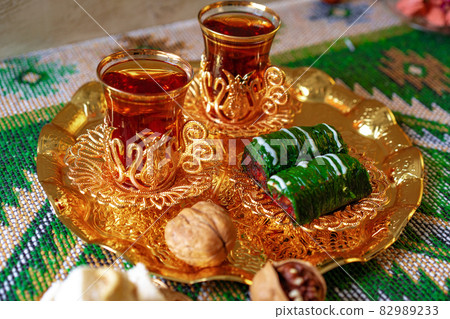 Turkish sweet baklava on metal tray with Turkish tea 82989233