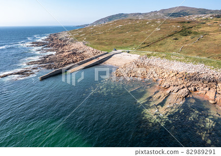 Aerial view of the pier by Marmeelan and Falcorrib south of Dungloe, County Donegal - Ireland 82989291