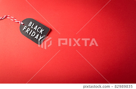 Top view of Black Friday sale tag on red background. Shopping concept boxing day and Black Friday composition. Top view of Black Friday sale tag on red background. Shopping concept boxing day and Black Friday composition. 82989835