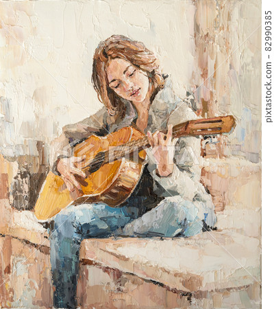 .The girl plays the guitar. 82990385