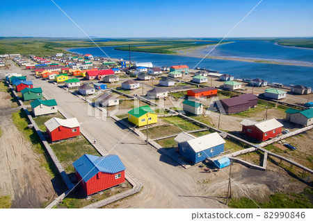 Colorful houses in the northern settlement in the Arctic. Kanchalan, Chukotka, Russia. 82990846