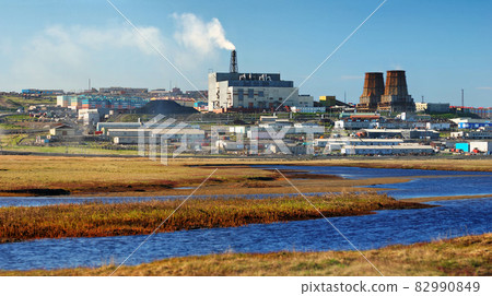 View of the river in the tundra, combined heat and power plant and industrial facilities. Anadyr, Chukotka, Russia. 82990849