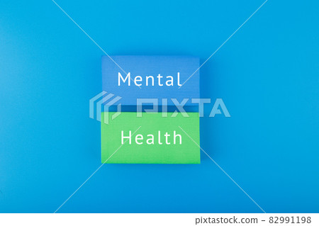 Mental health text written on colorful blocks on dark blue background Mental health text written on colorful blocks on dark blue background 82991198