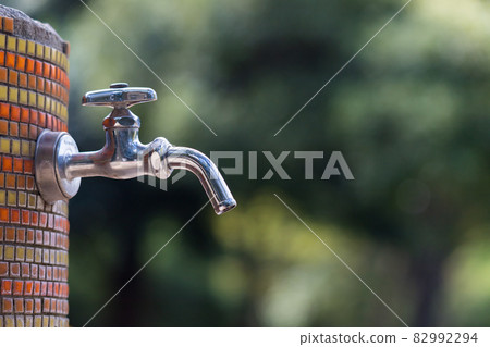 Tap water faucet in the park barbecue Tap water faucet in the park barbecue 82992294
