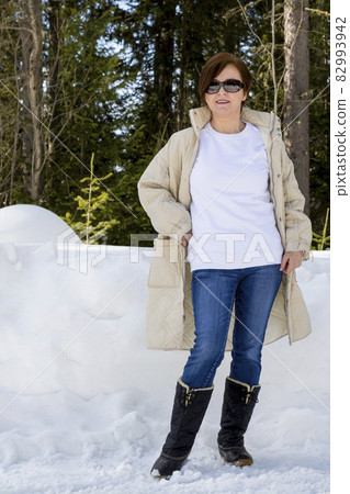 White sweatshirt mockup of a woman wearing black snow boots 82993942