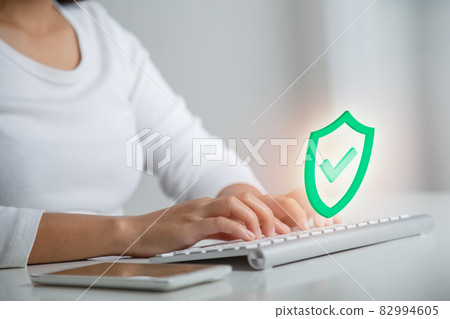 Businesswoman working on working on wireless keyboard, select icon security in personal data security, Business, technology, internet and networking, cyber data or information privacy concept. 82994605