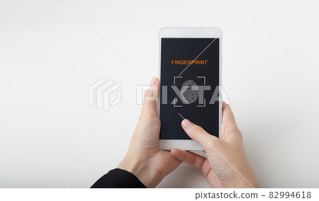 Female hand scanning fingerprint on smartphone screen, Unlock mobile phone, unlock the device, on white background. 82994618