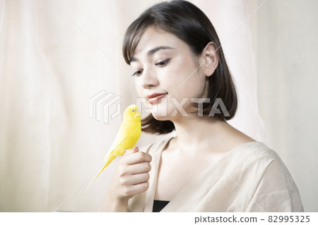 Pet birds and women 82995325