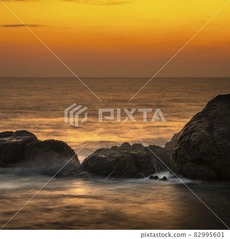 Sunset Beach in Galle, beautiful rock formation on the coast. Long exposure waterscape photograph. Sunset Beach in Galle, beautiful rock formation on the coast. Long exposure waterscape photograph. 82995601