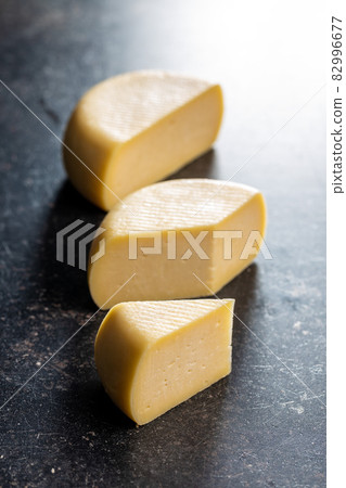 Block of hard cheese. 82996677