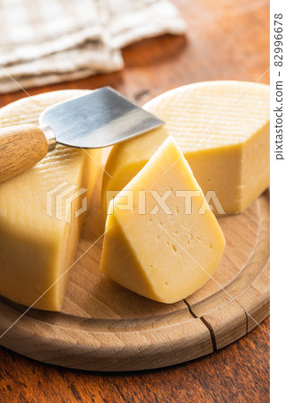 Block of hard cheese. Block of hard cheese. 82996678