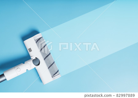 White vacuum cleaner brush on a blue background With a clean stripe White vacuum cleaner brush on a blue background With a clean stripe 82997889