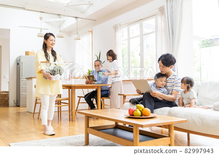 Three-generation family relaxing in the living room Three-generation family relaxing in the living room 82997943