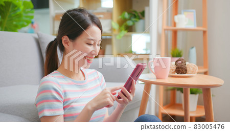 Asian woman using smartphone 83005476