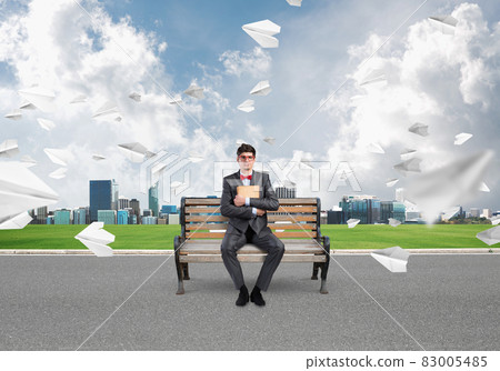 young businessman with a book young businessman with a book 83005485
