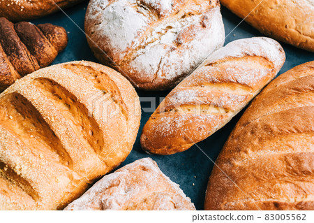 Different types of fresh bread and bakery on the table. Different types of fresh bread and bakery on the table. 83005562