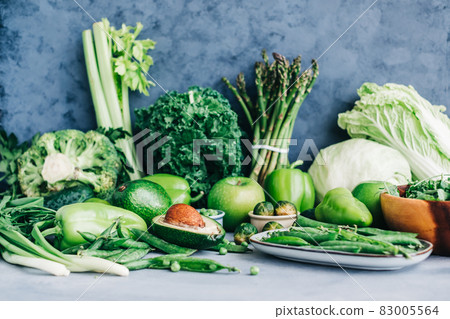 Healthy organic green food, assortment of fresh vegetables: Avocado, lettuce, broccoli, green peas, cucumber, pepper, celery, kale, asparagus and other. Healthy organic green food, assortment of fresh vegetables: Avocado, lettuce, broccoli, green peas, cucumber, pepper, celery, kale, asparagus and other. 83005564