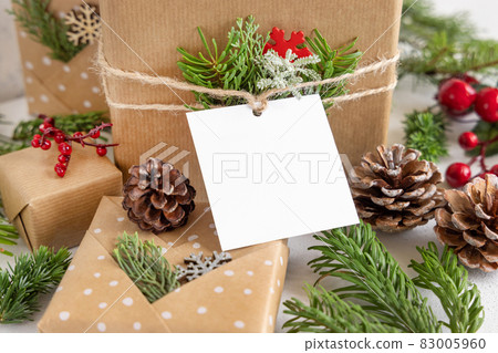 Christmas present with square blank gift tag close up, Mockup Christmas present with square blank gift tag close up, Mockup 83005960