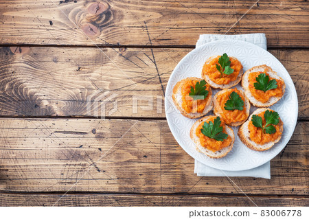 Sandwiches with bread zucchini caviar tomatoes onions. Homemade vegetarian food. Canned stewed vegetable. wooden background top view, copy space Sandwiches with bread zucchini caviar tomatoes onions. Homemade vegetarian food. Canned stewed vegetable. wooden background top view, copy space 83006778