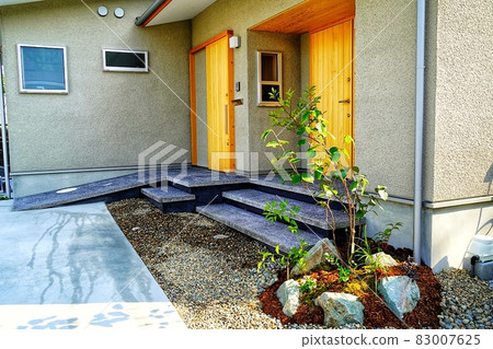 Entrance and exterior of a two-family house 83007625