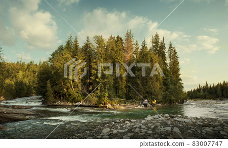 Camping of a recluse in the wilderness at the river bend 83007747