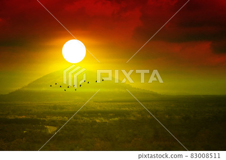 blur sunrise on morning sky over hill and mountain and bird flying 83008511